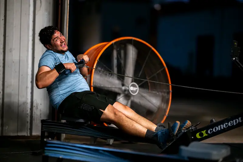 Member grinding on the rower